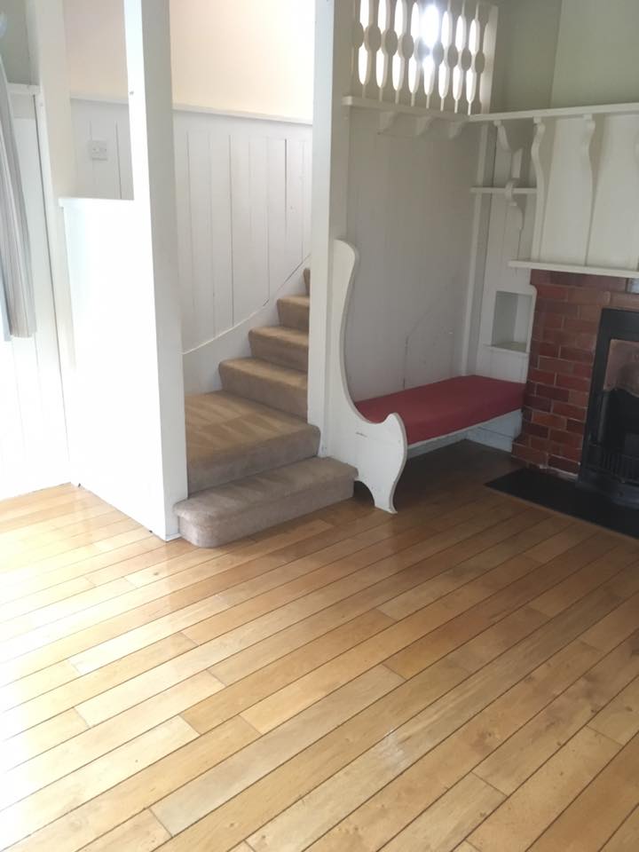 clean carpeted stairs and shiny wooden floors