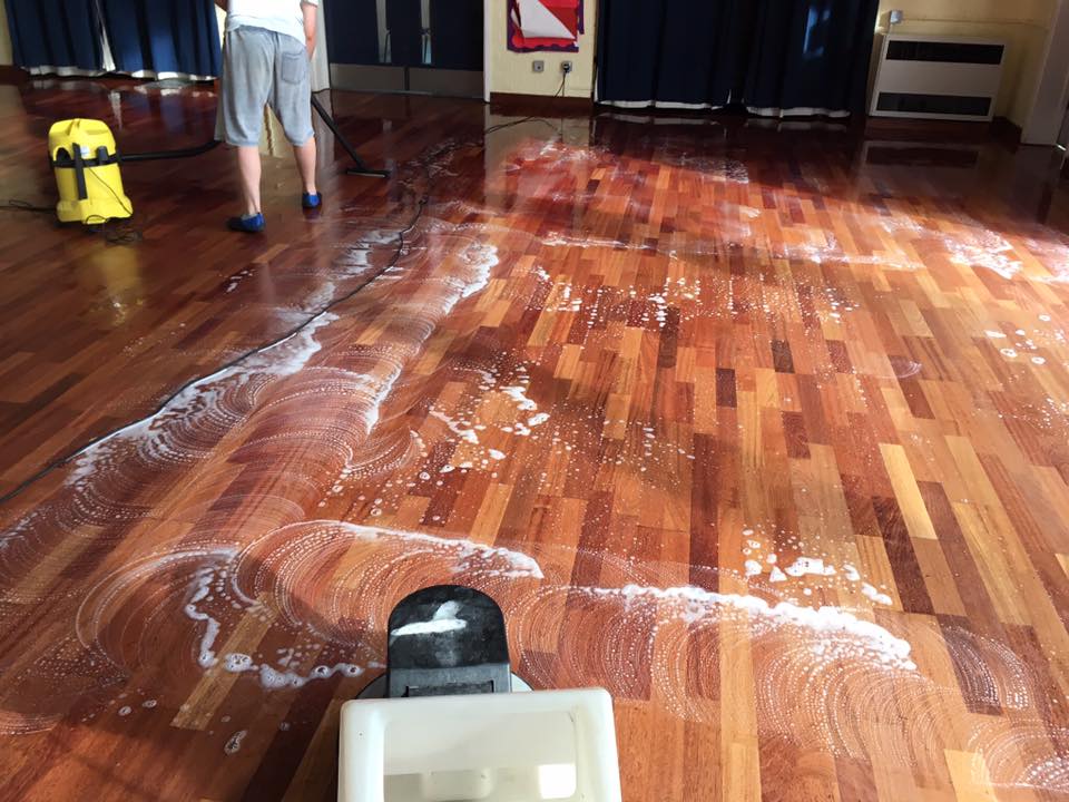 soapy wooden floor being cleaned